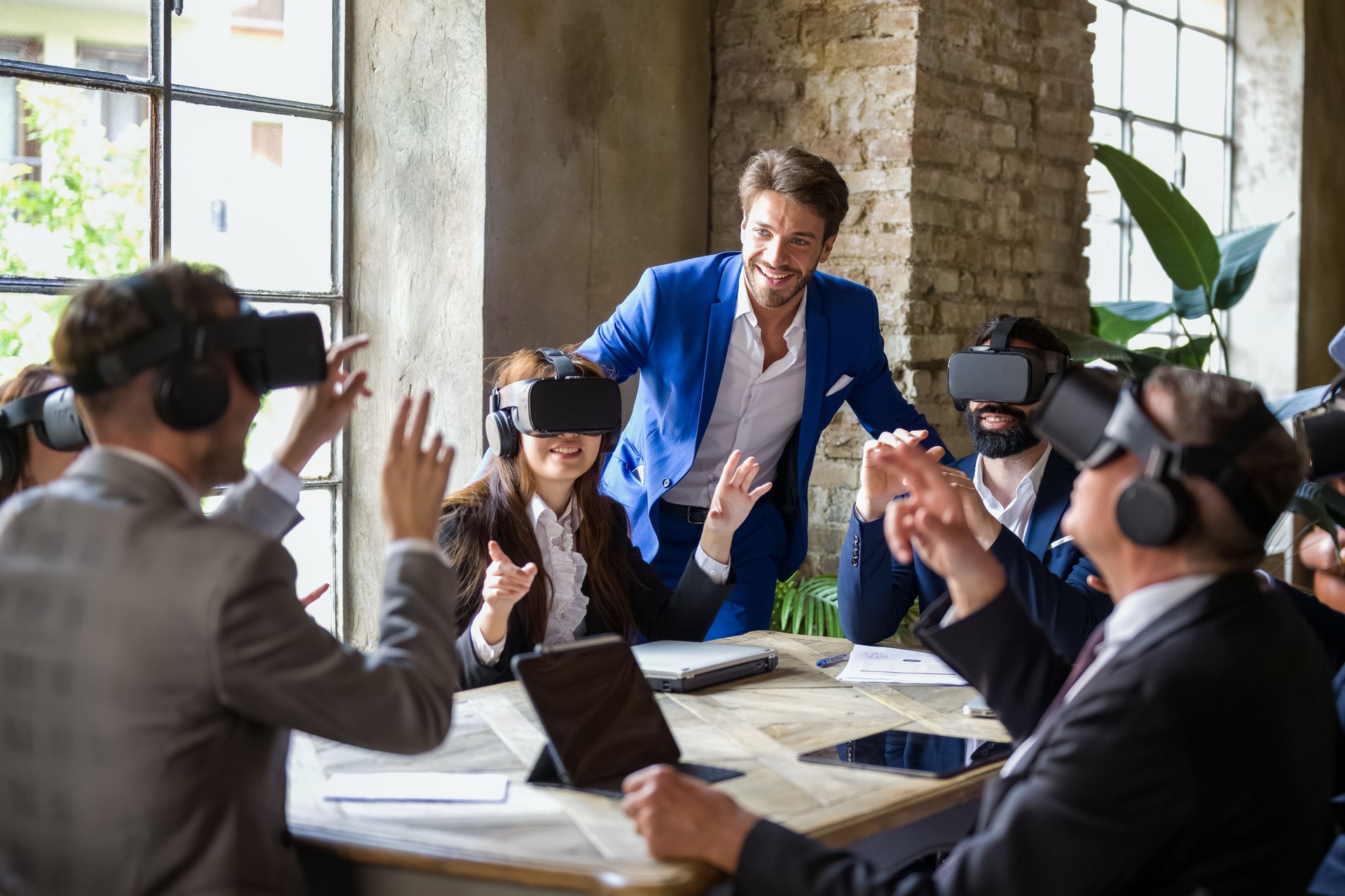 Augmented reality session in a business meeting run by an experienced technician, working group that uses new technological tools to optimize business and finance